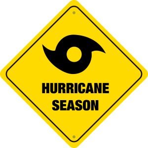 Hurricane season warning sign emphasizing preparation for plumbing issues in Sunrise, Florida.