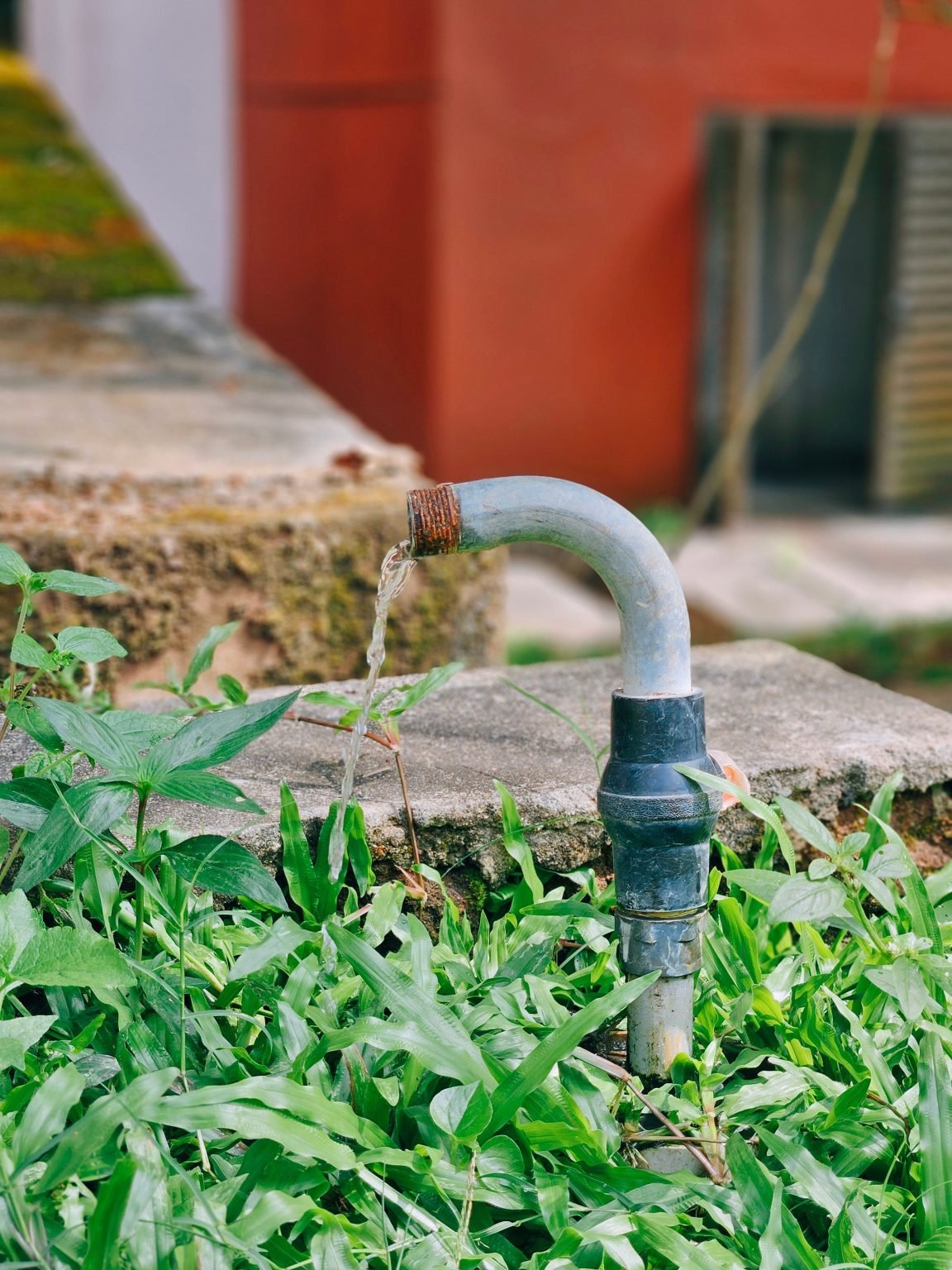 Outdoor water spigot with flowing water, hurricane plumbing preparation in Oakland Park, FL