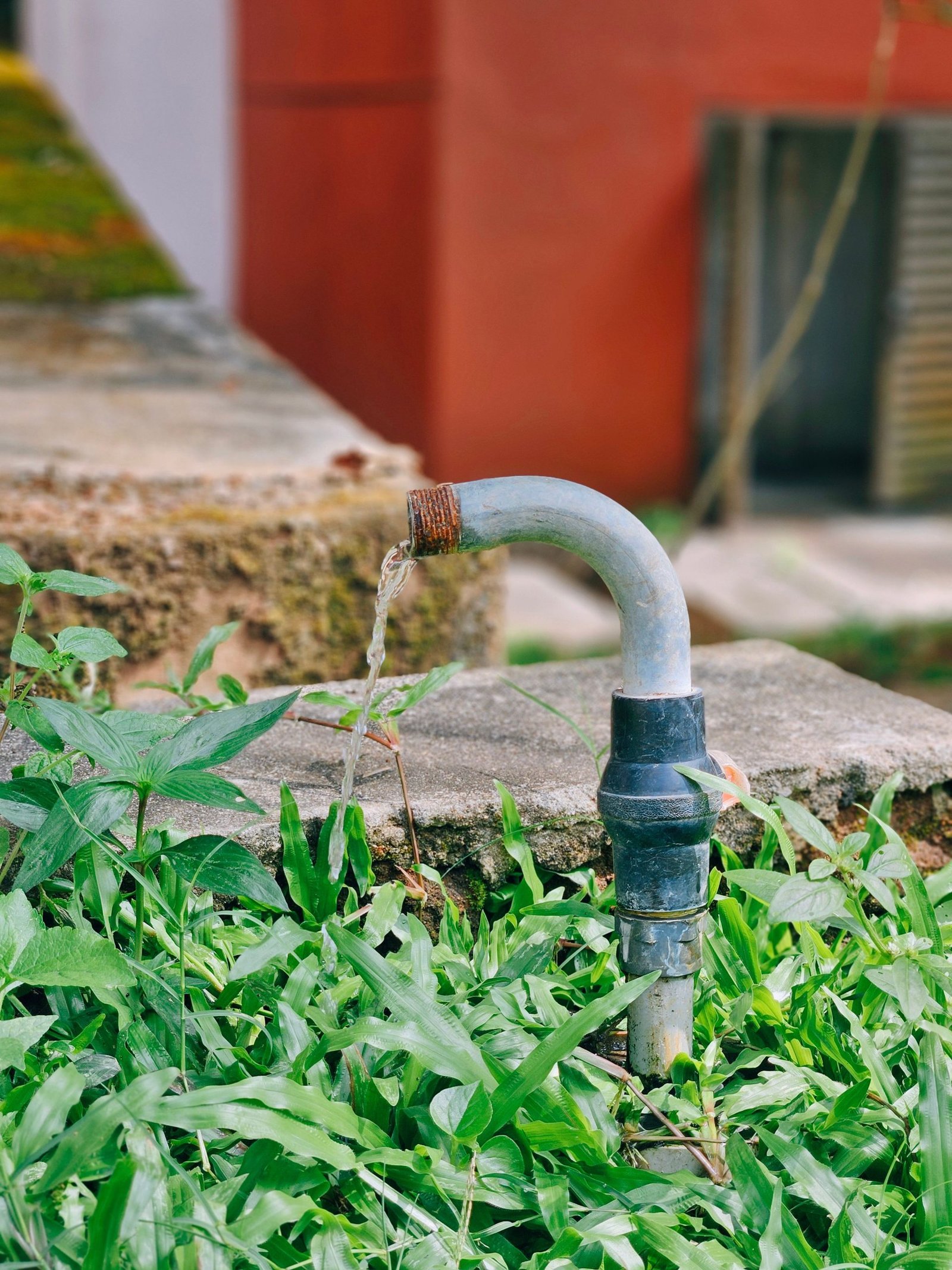 Outdoor plumbing fixture with water leak illustrating hurricane preparedness for Oakland Park homes.